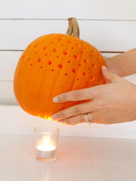 Using different sized drill bits to create a design on a pumpkin. Pumpkin Drilling, Veselý Halloween, Pumkin Decoration, Pumpkin Uses, Fake Pumpkins, Creative Pumpkins, Zucca Halloween, Halloween Pumpkins Carvings, Carving Ideas