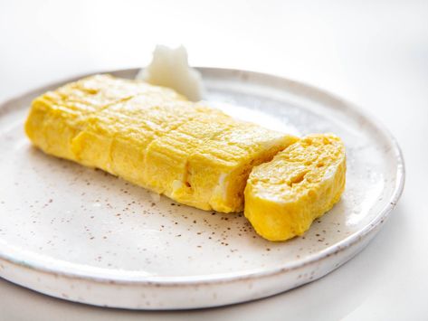 Tamagoyaki is a popular item on sushi menus, but it can be eaten hot or cold at any time of day, as part of a light breakfast, snack, lunch, or dinner. Omelette Sandwich, Japanese Flavors, Rolled Omelette, Ham And Cheese Omelette, Japanese Omelette, French Omelette, Sushi Mat, Sushi Menu, Snack Lunch