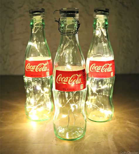 Coke bottle Luminarias by CraftyChica.com Coke Bottle Crafts, Glass Coke Bottles, Coca Cola Party, Coca Cola Kitchen, Coca Cola Decor, Always Coca Cola, Coca Cola Bottles, Bottle Centerpieces, Bg Design