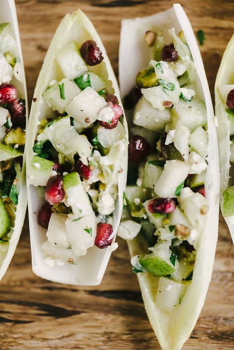 These endive cups are a fast, easy, and healthy holiday party appetizer. They're naturally vegetarian and gluten free, and bursting with flavor. The beautiful green hues and pops of red are seasonal and cheerful. Yum! #glutenfree #vegetarian #appetizer #holidayparty #christmasrecipe #winterrecipe Party Appetizers Vegetarian, Vegan Christmas Appetizers, Endive Cups, Endive Appetizers, Appetizers Vegetarian, Appetizer Cups, Cocktail Party Appetizers, Vegetarian Appetizer, Holiday Party Appetizers