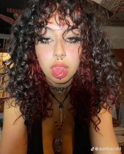 Half Colored Hair Underneath Curly Hair, Curly Hair With Red Underneath, Dark Brown Hair With Dark Red Underneath, Red Under Dye Curly Hair, Grunge Hair Dye Ideas Curly, Brown And Red Curly Hair, Purple Peekaboo Curly Hair, Peak A Boo Curly Hair, Red Skunk Stripe Hair Curly