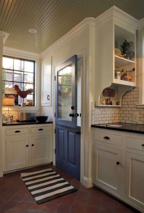 Terra cotta floors, black granite counters, white cabinets, subway tile | Designers: Nathan Waldon and Tom Berkelman  Photo: Carlos Avila Gonzalez / The Chronicle Tudor Kitchen, Kitchen Technology, Blue Shutters, Tuscan Design, Tuscan Kitchen, Mediterranean Home Decor, Mediterranean Home, Kitchen Doors, Kitchen Plans