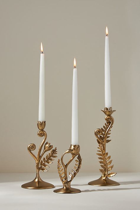 With an unfurling fern finished in bloom, this exquisite taper candle holder lends an air of enchantment to your dining table. | Fiddlehead Fern Taper Candle Holder by Anthropologie in Gold, Size: Large Anthropologie Home Aesthetic, Cottagecore House Aesthetic, Anthropologie Home Decor Inspiration, Anthropologie Vibes, Realistic Bedroom, Dining Room Aesthetic, Fiddlehead Fern, Practical Magic House, Fiddlehead Ferns