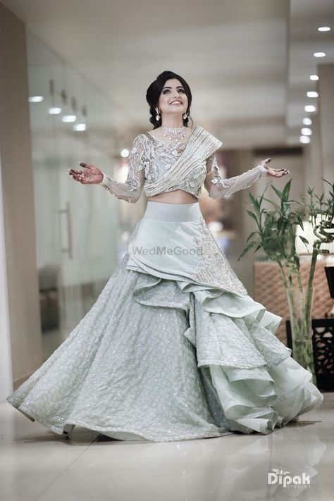 Photo of Layered floor length gown in pastel shade Lahanga Design, Braid Dress, Engagement Dress For Bride, Lehenga Choli Designs, Indian Wedding Gowns, Skirt Ideas, Garment Construction, Dress Designing, Gown Party Wear