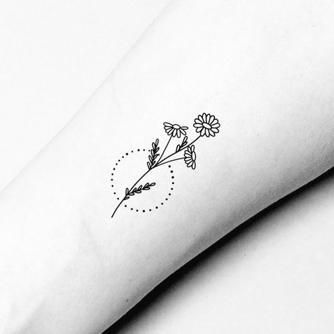 Looking for a tattoo that's more than just skin deep? Discover 17 meaningful tattoo ideas that will speak to your soul and leave a lasting impression. From powerful symbols to personal mantras, these designs are sure to inspire your next ink adventure. Here are 17 Meaningful Tattoo Ideas for Women That Will Leave You Inspired and Inked. Daisy Collar Bone Tattoo, Simple Daisy Tattoo Outline, Daisy Simple Tattoo, Dainty Daisy Tattoo Simple, Small Wildflower Tattoo Simple, Tattoo Daisies, August Tattoos, Simple Outline Tattoo, Wrist Tattoo Small