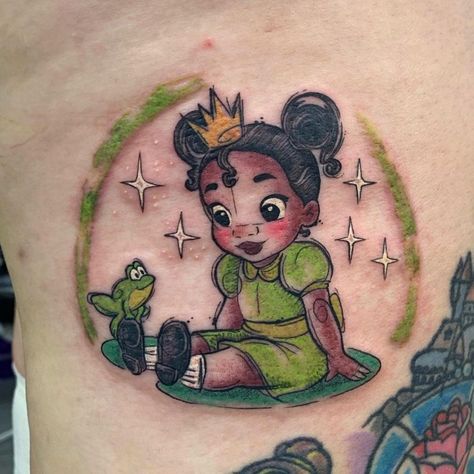 Up Disney Tattoo Ideas, Princess And The Frog Inspired Tattoo, Tiana Princess And The Frog Tattoo, Small Character Tattoos, Tiana Tattoo Disney, Disney Tattoos Princess, Disney Glitter Tattoo, Cartoon Tattoos Women, Cartoon Characters Tattoo Ideas