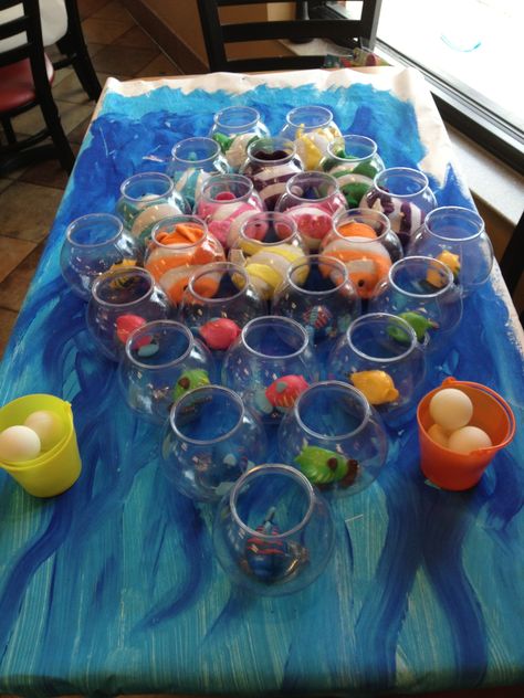 This fun under the sea themed game was found online at a party supply website… Finding Nemo Party Games, Sea Themed Party Favors, Fish Bowl Toss, Dory Birthday, Dory Party, Carnival Games For Kids, Bubble Guppies Birthday Party, Underwater Party, Nemo Party