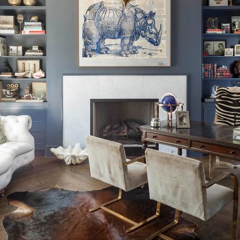 Cowhide Rug Office, Home Library With Fireplace, Blue Home Offices, Masculine Office, Office With Fireplace, Dark Wood Desk, Rhino Art, Office Diy, Office Remodel