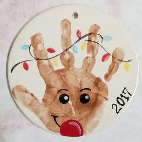 Baby Footprint Clay Christmas, Hand Feet Christmas Crafts, Baby Print Ornament Diy, Christmas Crafts For Kids Footprint, Christmas Baby Art Hand Prints, Reindeer Ornaments Handprint, Rudolph Handprint Ornament, Hand Print Rudolph, Toddler Christmas Ornaments Diy Hand Prints