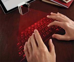 Have a keyboard with you any where you go with this virtual infrared keyboard. This virtual infrared keyboard is the size a cell phone but allows you have the functionality of a full size keyboard, with the added benefit of wireless Bluetooth technology. Buy It $169.99 via Amazon.com Laser Keyboard, Virtual Keyboard, Magic Cube, Take My Money, Gadgets And Gizmos, Ideal Wedding, Cool Tech, Cool Technology, Technology Gadgets