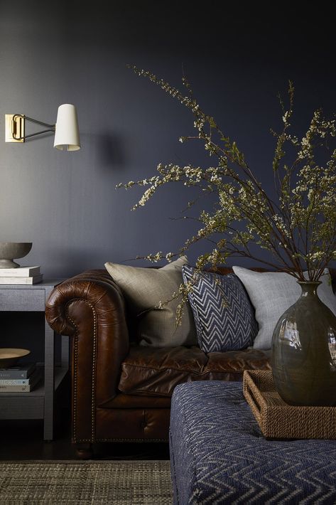 Navy Walls Brown Sofa, Brown Sofa Wall Color Ideas, Brown Black And Blue Living Room, Smokey Blue Accent Wall, Moody Navy Living Room, Dusky Blue Living Room, Earthy Blue Living Room, Blue And Brown Interior Design, Navy Blue Living Room Walls