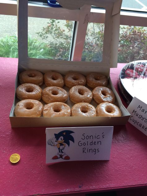 Sonic Birthday Party Favor Ideas, Sonic Donut Wall, Sonic The Hedgehog Birthday Party Cake Ideas, Sonic Party Snack Ideas, Sonic Snack Ideas, Sonic Hedgehog Birthday Party, Sonic Treat Table, Sonic Snack Table, Sonic Donuts Ideas