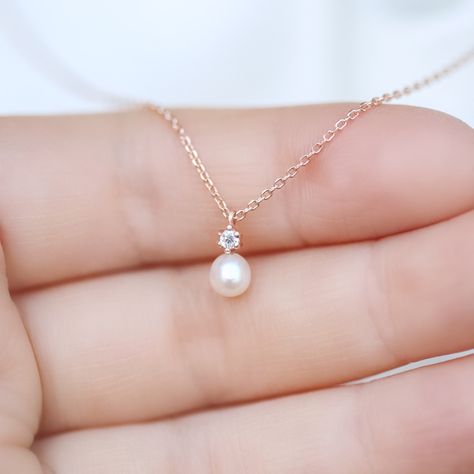 Tiny Diamond & Pearl necklace✨ fresh water pearl and natural diamond setting pendant necklace. 14K solid gold jewelry. * Detail * Material : 14k solid gold with fresh water pearl and genuine diamond. color : rose gold, gold or white gold * Size * Necklace length : 16.5 inches (If you want change chain length, please leave order note.) Pendant : 5*10 mm Diamond: Genuine 2mm brilliant cut diamond / VS Clarity / H color. Pearl : 4.5~5mm fresh water pearl.  *We provide special package with some Simple Pearl Pendant, Diamond Necklace Simple, Jewelry Necklace Simple, Simple Pearl Necklace, Fresh Water Pearl Necklace, Water Pearl Necklace, Pearl Necklace Designs, Pearl And Diamond Necklace, Pearl Necklace Wedding