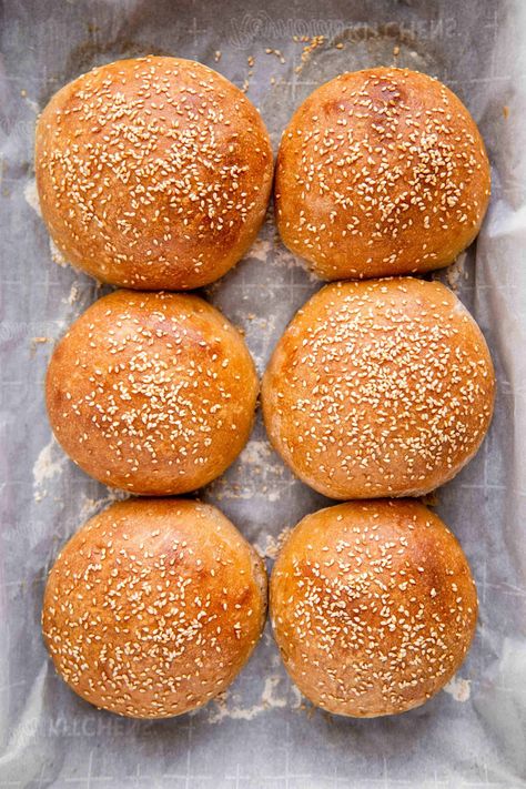 These soft, fluffy, flavorful buns will be the star of any hamburger meal. They're just spongy enough to soak up all that delicious burger juice, and any sauce you top your burger with, while also staying sturdy enough to hold a big juicy burger. A light egg wash gives these buns a flaky golden top, perfect for classic sesame seeds. Once you try this sourdough bun recipe, you'll never go back to store bought burger buns! Soft Hamburger Bun Recipe, Hamburger Meal, Sourdough Hamburger Buns, Sourdough Bun Recipe, Hamburger Bun Recipe, Juicy Burger, Aesthetic Foods, Big Juicy, Wild Yeast