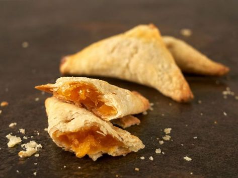 Warm Pineapple Turnovers Pastry Cookies, Turnover Recipes, Jamaican Food, Caribbean Food, Yellow Foods, Lemon Rind, Pastry Flour, Jamaican Recipes, Egg Wash