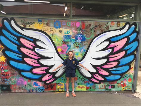 Mont Albert Primary School Mural | Blender Creatives | Creative Art ... Wing Mural, Seni Mural, Angel Wings Art, Wall Street Art, School Wall Art, School Murals, School Painting, Zumba Dance, تصميم داخلي فاخر