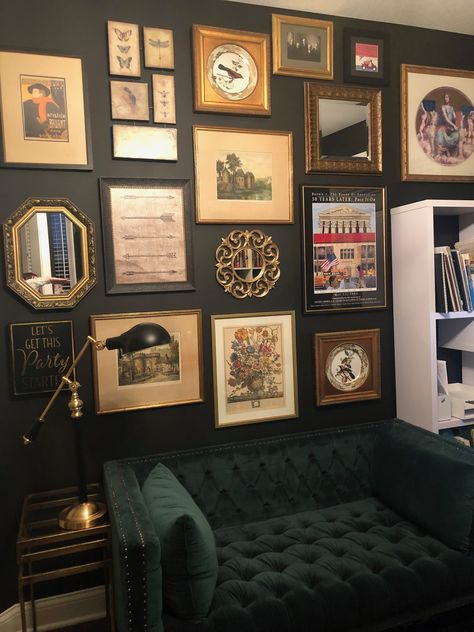 Gallery wall, green sofa, black wall, gold frames Picture Wall Ideas Dark Wall, Green Walls Gold Frames, Black Accent Gallery Wall, Black Wall Lounge Room, Gallery Wall Black And Gold, Black Wall With Frames, Maximal Wall Art, Green Wall With Pictures, Gold Frames On Black Wall