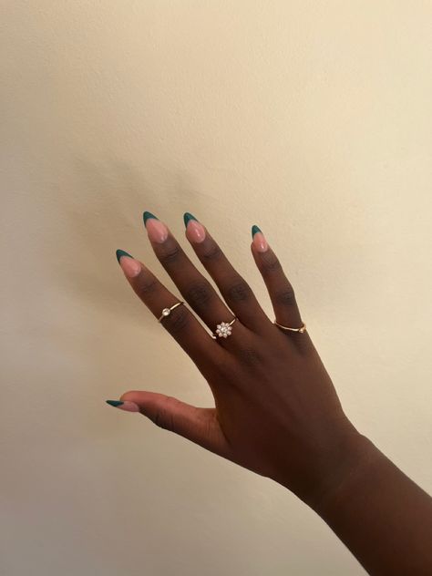 black girl hands and green French tips, almond shaped with golden rings Emerald Green French Tip Nails Almond, Forest Green French Tip Nails, Emerald Nails Acrylic, Colour French Tips Nails, Emerald Green French Tip Nails, Dark Green French Tip Nails, Dark Green French Tip, Green French Tip Nails, Green French Tips