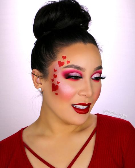 Valentines Day makeup idea: red half cut crease eyeshadow look with red hearts drawn on face Hearts On Face Makeup, Red Valentine Makeup Look, Valentines Creative Makeup, Heart Make Up, Cupid Makeup Looks, Valentines Day Makeup Simple, Valentine’s Day Make Up, Valentine’s Day Make Up Looks, Valentines Day Makeup Creative