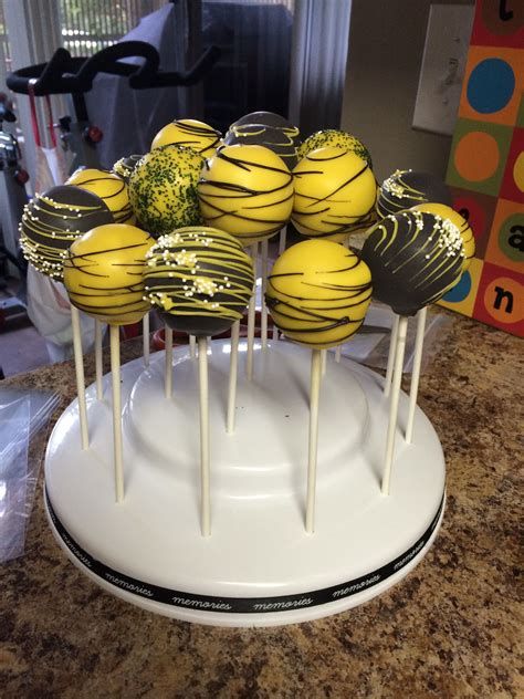 cake pops yellow and black. There are any references about cake pops yellow and black in here. you can look below. I hope this article about cake pops yellow and black can be useful for you. Please remember that this article is for reference purposes only. #cake #pops #yellow #and #black Black And Yellow Birthday Decorations, Yellow And Black Graduation Party Ideas, Black And Yellow Cake, Hockey Treats, Yellow Cake Pops, Sweets Business, Cake Cake Pops, Yellow Desserts, Black White Cakes