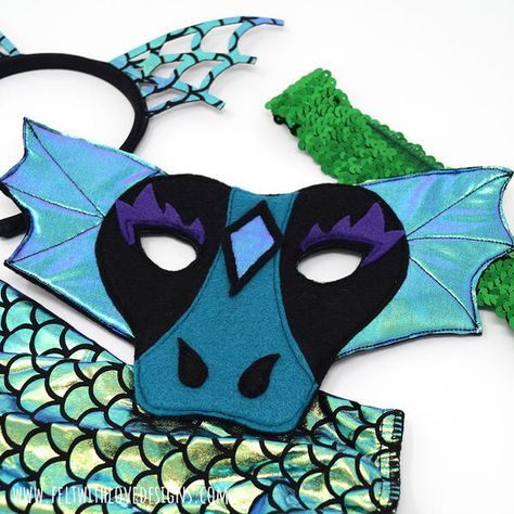 Sew a felt dragon mask for your child's (or your) dragon costume with this tutorial. Whether you are trick or treating this year or staying home and enjoying Halloween costumes and fun at home, this dragon mask will add the perfect touch to any DIY dragon costume. You may use the tutorial to make things to sell, handmade gifts for family and friends, and more. The tutorial includes detailed steps with photos for creating your own dragon mask. Rainbow Dash Costume, Diy Dragon Costume, Felt Dragon, Game Of Thrones Gifts, Felt Glue, Dragon Mask, Dragon Costume, Mask Pattern, Dragon Toys