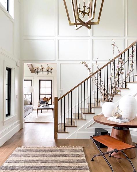 Modern Cozy Staircase, Paneling On Staircase, Crown Molding On High Ceilings, Open Staircase Accent Wall, Two Story Wainscoting, Stair Ballister Ideas, Paneling On Stairs, Wall Paneling Staircase, Vaulted Foyer Entryway