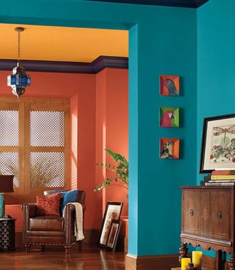 COLOR HARMONY: This is a split-complementary color scheme. The oranges on the back walls and ceiling are not true oranges; one is more red, and the other is more yellow. Drawing Room Decor, Deco Studio, Living Room Orange, Living Room Color Schemes, Exterior Paint Colors For House, Room Paint Colors, Room Color Schemes, House Decorating, Paint Colors For Living Room