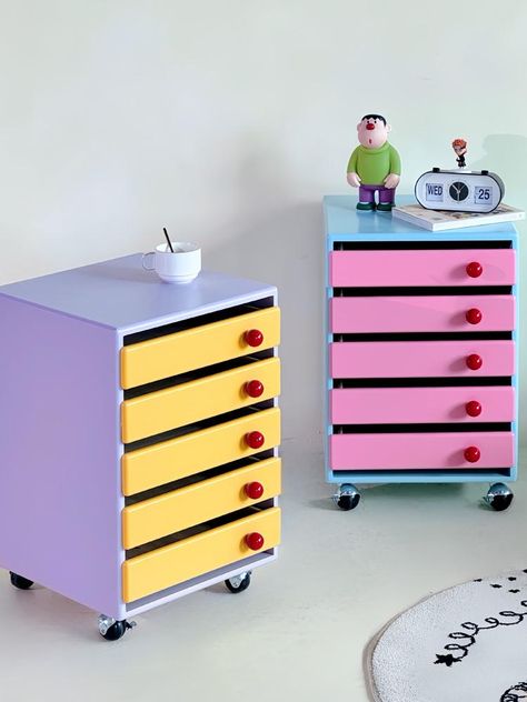 Add a splash of color and functionality to your home or office with our pastel-colored storage cabinet. Designed to keep your space organized while adding a stylish touch, this cabinet is perfect for storing files and other essentials. Enhance your decor with the vibrant elegance of our Pastel Colored Storage Cabinet. Whether used for organizing files or as a decorative piece, it’s sure to add both style and practicality to your space. Specifications Size: L40*W40*H60cm Material: MDF Wood Featur Funky Retro Decor, Weird Interior Design, Pastel Apartment, Kawaii House, Cart Coffee Table, Kitchen Cups, Bedside Table Design, Colorful Storage, File Organizer