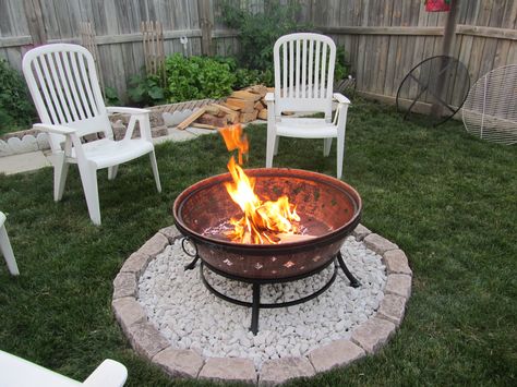 simple, use the brazier we have and just pebble under it so it won't kill the grass! Fire Pit Grass Area, Basic Fire Pit Ideas, Portable Fire Pit Ideas Backyards, Pebbles Around Fire Pit, Simple Diy Fire Pit Area, Fire Pit In Grass Area, Fire Pit Simple, Fire Pit On Grass Backyard Ideas, Simple Diy Fire Pit