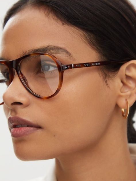 1970s retro codes are a key reference for Isabel Marant, evidenced through these brown glasses which are made from tortoiseshell acetate with oversized round frames. Acetate Key Reference, Tortoise Shell Glasses, Brown Glasses, Round Eyewear, Round Frames, Tortoise Shell, Spectacles, Isabel Marant, Clothing And Shoes