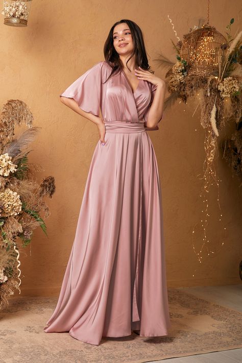 Fashionable bridesmaid,evening dress made of noble mixed silk with a beautiful overflow will emphasize the beauty and style of their owners and look appropriate at any gala event. Such an elegant evening dress will attract attention at every party and make the image delicate and mysterious. A gorgeous maxi length dress with a short loose sleeve, a wrap neckline and elastic at the waist. A piquant note along with adds a cut from the waist along the hip line. In such a dress you will feel like a r Beige Satin Dress Long Sleeve, Silk Satin Dress With Sleeves, Pink Silk Dress Short, Satin Bridesmaid Dresses With Sleeves, Satin Rock, Sleeve Bridesmaid Dress, Rose Bridesmaid, Bride Maids, Satin Ruffle Dress