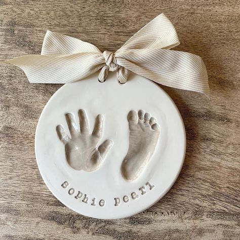 Thought I would post another hand and footprint in my favorite color. Taupe can go in any space in your house, wether the pallet is warm or… | Instagram Mistletoes Footprint Craft, Footprint Ornament, Baby Christmas Crafts, Baby Footprint Art, Footprint Keepsake, Footprint Crafts, Baby Keepsakes, Baby Handprint, Diy Bebe