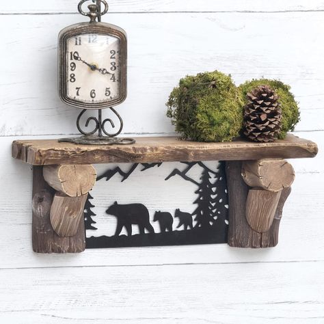 PRICES MAY VARY. 60 Day No Hassle Returns A Black Forest Decor Exclusive - Add a rustic touch to your wall with this metal and resin wall shelf featuring a realistic wood finish and bear silhouette accents. 15 3/4"W x 5 1/8"D x 6"H. Rustic Accent Furniture, Montana Decor, Dresser Decoration, Modern Cabin Decor, Mountain House Decor, Woodland Home Decor, Rustic Wood Crafts, Twig Furniture, Moose Decor