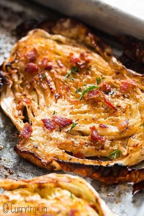 Cabbage steaks roasted in oven and garnished with Parmesan and bacon on baking tray Oven Roasted Cabbage, Baked Cabbage Steaks, Cabbage Steaks Recipe, Roasted Cabbage Steaks, Cabbage Recipes Healthy, Baked Cabbage, Dry Ranch Seasoning, Cabbage Steaks, Roasted Cabbage