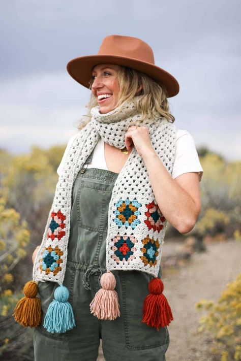 Granny square scarf with tassels modeled by a woman in the desert. Crochet Granny Stitch, Granny Square Scarf, Scrap Yarn Crochet, Make And Do Crew, Modern Crochet Patterns, Scarf Yarn, Crochet Triangle, Make Do, Crochet Motifs