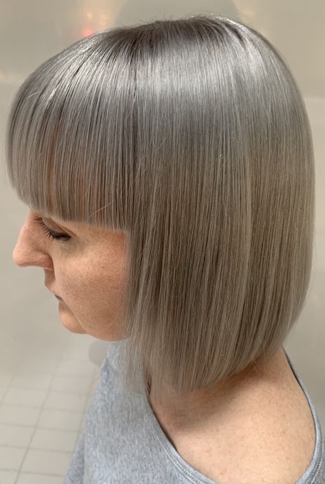 How better to compliment a strong bob...... lets add a Dove grey by Schwarzkopf! We started by doing a global application prelightener with Wella Blondor added with Olaplex. After achieved lift we pre toned it with Diarichesse 9.01+ 9.02. The last stage was to add Dove Grey by Schwarzkopf. To finish off we used Sebastian Professional Trilliance to bring out the ultimate shine with the blowdry! Bring on autumn I say! Dove Grey Hair, Grey Hair Colour, Hair Dye Trends, Gray Hair Dye, Womens Bob Hairstyles, Bobbed Hair, Grey Hair Dye, Sebastian Professional, Bob Hairstyles With Bangs