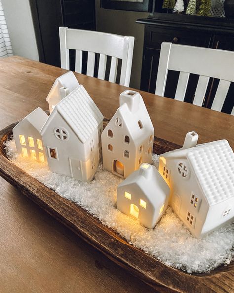 Lit up white ceramic houses in the snow in a dough bowl Small Dough Bowl Christmas Decor, Wood Dough Bowl Centerpiece Christmas, Winter Bread Bowl Decor, Wooden Bowl Christmas Decor, Bowl Styling, Dough Bowl Centerpiece, Bowl Decor, Holiday Table Centerpieces, Bowl Ideas