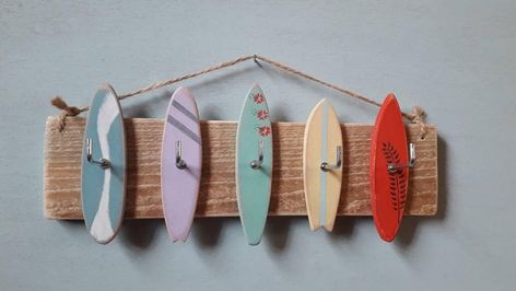 These very cool surfboard hooks can be used to hang jewellery, keys or medals. They are made from reclaimed wood and hung using natural twine. It measures approximately 28cm wide. Surfboard Key Holder, Coastal Cowgirl Apartment, Surfing Room, Surfboard Decoration, Surfer Bedroom, Beach House Paint Colors, Decoration Surf, Costal Bedroom, Beach Room Decor