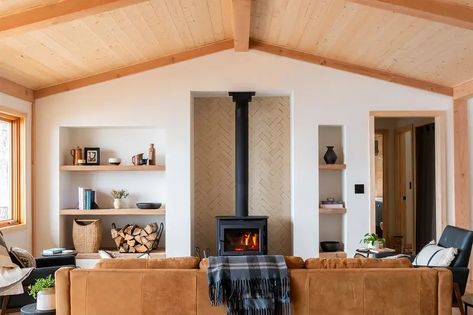 For This Lake Superior Cottage Renovation, the Designer Nixed a Stone Fireplace in Search of a View Kitchen With Big Island, Sliding Doors Exterior, Cottage Renovation, Scandinavian Interiors, Decoration Inspiration, Built In Shelves, Lake Superior, Wood Burning Stove, Stone Fireplace