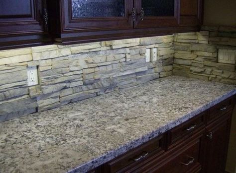 29 Cool Stone And Rock Kitchen Backsplashes That Wow Stacked Stone Backsplash, Dapur Rustic, Tuscan Kitchen Design, Stone Countertops Kitchen, Natural Stone Backsplash, Backsplash With Dark Cabinets, Stone Backsplash Kitchen, Trendy Kitchen Backsplash, Farmhouse Backsplash