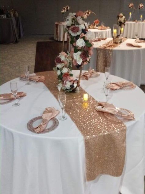 Elegant Rose Gold Wedding Decor, Sweet 16 Table Centerpieces Rose Gold, Rose Gold Table Runner Centerpiece Ideas, White Wedding Dress With Rose Gold Accents, Rose Gold Party Backdrop, Rose Gold Table Setting Wedding, Rose Gold Dinner Table Decor, Rose Gold Table Decorations, Rose Gold Table Setting