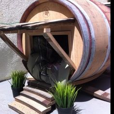 wine barrel dog houses | Mansions and Fine Art Made Especially for Cats and Dogs Barrel Dog House, Luxury Dog Kennels, Dogs House, Custom Dog Houses, Outdoor Dog House, Cool Dog Houses, Wine Barrel Furniture, Dog Wine, Dog House Diy