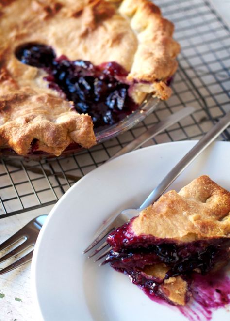 This recipe comes from the so-called Grape Pie Queen of Naples, New York, Irene Bouchard. She started baking these sweet pies in the early '70's. Concord Grape Pie, Berries Pie, Fodmap Desserts, Grape Pie, Mixed Berry Pie, Plum Pie, Slice Of Pie, Grape Recipes, Types Of Desserts