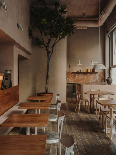 Plantea Estudio pairs rough textures and earthy tones in Madrid restaurant Alvar Aalto Chair, Madrid Restaurants, Marble Worktops, Modernist Architects, Wooden Floorboards, White Light Fixture, Timeless Interior, Timeless Interiors, Charlotte Perriand