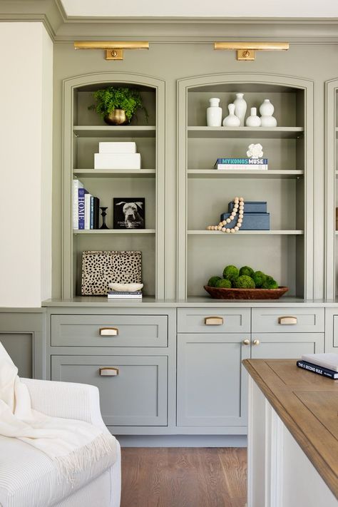 Family Room Tv Built In, Painted Oak Built Ins, Gray Built In Bookshelves, Built In Cabinet Paint Colors, Light Green Built Ins, Built In Paint Ideas, Sage Built In, Den Cabinets Built Ins, Painted Living Room Built Ins