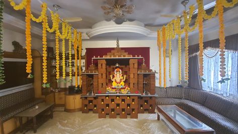 Eco-friendly and Sustainable Ganesh Chaturti Celebration.  *Ganesh Mandir*   The temples complex comprises of  3 parts. The one in centre is for deity lord Ganesha  and other 2 are for deep(lord agni)  Whole decoration is been composed of 375 Clay Bricks and Natural Kaddapa stone as base materials. No mortar or adhesive has been used to bind the bricks; thus it can be reused with zero wastage  The  arrangement of bricks is done in such a way so as to support the weight of stone, murti and kalash Brick Decoration For Ganpati, Ganpati Decoration Theme, Clay Bricks, Ganpati Decoration At Home, Ganapati Decoration, Decoration For Ganpati, Brick Decor, Fashion Show Dresses, Ganesh Ji