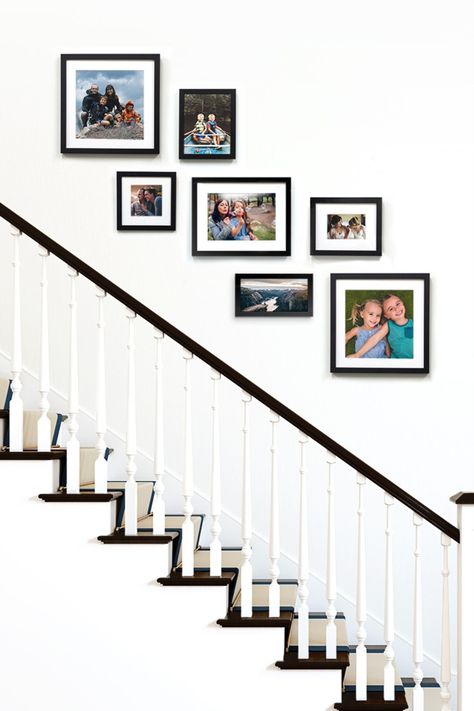 Black gallery wall of frames over a staircase. Picture Placement On Stair Wall, Staircase Wall Frames Ideas, Photo Frames On Staircase Wall, Photo Frame Staircase, Frame Wall Ideas Stairs, Home Decor Stairway Wall, Gallery Wall Over Stairs, Wall Collage Stairway, Stairs Frames Ideas