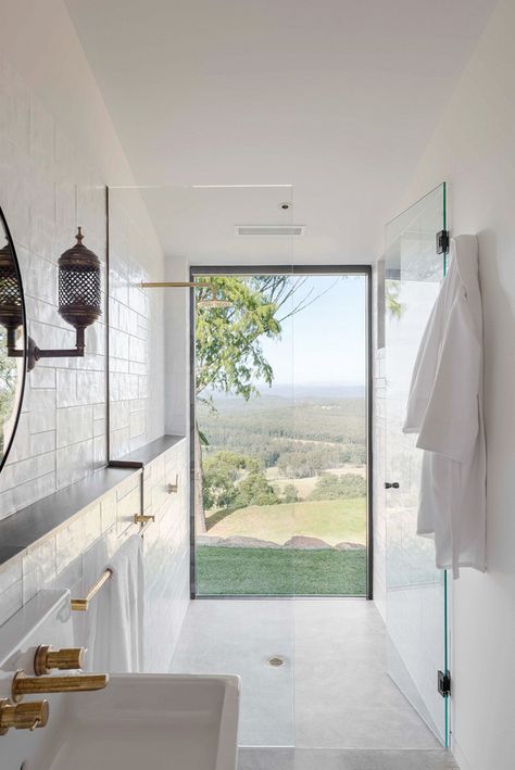 Forget the standalone tub—This year, it's all about showers that boast an unbeatable view. Houzz declares "showers that feel outdoor" will be the biggest bathroom trend of the year. "To get... Shower Windows Ideas, Architecture Renovation, Tropical Bathroom, Window In Shower, Bathroom Accessories Luxury, Bad Inspiration, Bathroom Windows, Big Bathrooms, Bathroom Trends