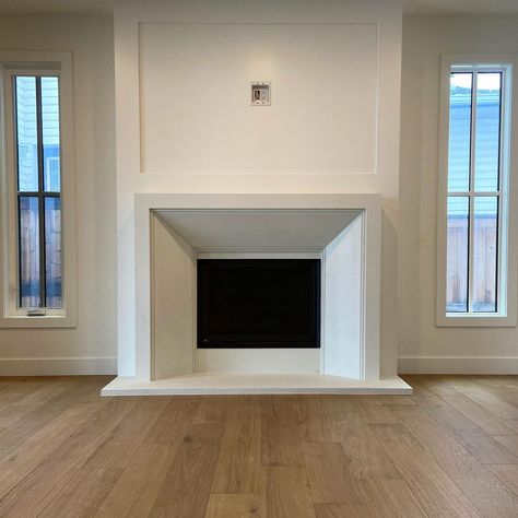 Flush To Wall Fireplace, Fireplace Ideas Living Room With Tv, Traditional White Fireplace, Stucco Fireplace Surround, Angled Fireplace Wall, Windows Flanking Fireplace, Dark Marble Fireplace, Frame Tv Over Fireplace, Quartz Fireplace Surround