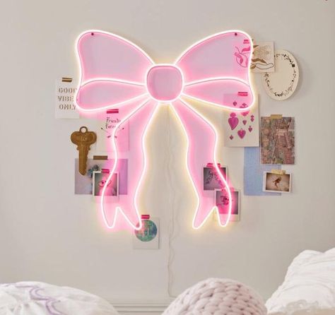 This eye-catching piece features your choice of pink or white LED bulbs forming a glowing bow silhouette, adding a magical touch to any room.  It's constructed from durable iron, plastic, and LED lights, ensuring longevity.  Easy to install with included mounting hardware and powered by a simple plug-in connection at 5 volts, it's both energy-efficient and enchanting. Led Room Signs, Preppy Led Lights, Room Decor Bedroom Pink And White, Pink Decor For Room, Cute Room Decor Night Lights, Cute Room Ideas Preppy, Pink Coquette Room Decor, Cute Led Signs, Affordable Room Decor Ideas